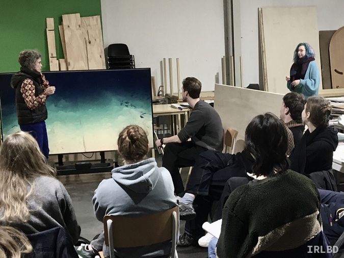 Christina Stadlbauer talking to an audience in front of screen